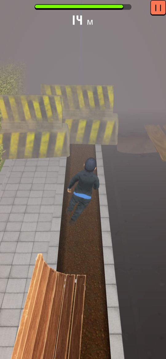 Running along a narrow path beside construction barriers